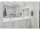 Elegant bathroom featuring a double vanity with modern fixtures and a large mirror at 2957 E Melrose St, Gilbert, AZ 85297
