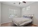 Comfortable bedroom with a ceiling fan and shuttered windows for natural light at 2957 E Melrose St, Gilbert, AZ 85297