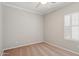Bedroom featuring neutral carpet, a ceiling fan, and a shuttered window at 2957 E Melrose St, Gilbert, AZ 85297