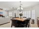 Charming dining area filled with natural light, accented by a modern chandelier and seating for six at 2957 E Melrose St, Gilbert, AZ 85297