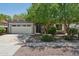 Charming single-story home with a two-car garage and mature shade trees in a well-maintained front yard at 2957 E Melrose St, Gilbert, AZ 85297