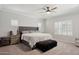 Comfortable bedroom with neutral decor, ceiling fan, soft lighting, and plush furnishings at 2957 E Melrose St, Gilbert, AZ 85297