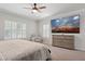 Inviting bedroom featuring neutral tones, shuttered windows, ceiling fan, and plush carpeting at 2957 E Melrose St, Gilbert, AZ 85297