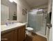 Bathroom featuring a shower and vanity sink with coordinated accessories at 316 S 74Th Way, Mesa, AZ 85208