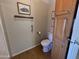 This cozy bathroom features wood floors and cabinets for handy storage at 316 S 74Th Way, Mesa, AZ 85208