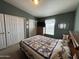 Bedroom featuring coordinated decor, natural light, closet and dresser at 316 S 74Th Way, Mesa, AZ 85208