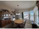 A cozy dining room with a round table and built-in cabinet at 316 S 74Th Way, Mesa, AZ 85208