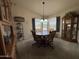 Cozy dining room with a chandelier, bay windows, and stylish decor at 316 S 74Th Way, Mesa, AZ 85208
