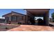 Inviting single-story home featuring a large covered patio and a spacious driveway for parking at 316 S 74Th Way, Mesa, AZ 85208