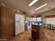 Bright kitchen features white appliances, a center island, and ample cabinet space at 316 S 74Th Way, Mesa, AZ 85208