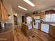 Functional kitchen features a central island, white appliances, and lots of cabinet space at 316 S 74Th Way, Mesa, AZ 85208