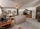 Spacious living room featuring plush sofas and a ceiling fan at 316 S 74Th Way, Mesa, AZ 85208