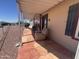Relaxing covered front porch with comfortable seating, perfect for enjoying neighborhood views at 316 S 74Th Way, Mesa, AZ 85208