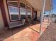Charming covered front porch with ample seating and a stylish entrance at 316 S 74Th Way, Mesa, AZ 85208