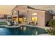 Serene backyard featuring a sparkling pool, lounge chairs, and mature landscaping at 33828 N Pate Pl, Cave Creek, AZ 85331