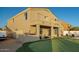 Spacious backyard featuring a putting green, outdoor kitchen, patio area, and a private pool at 33828 N Pate Pl, Cave Creek, AZ 85331