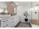 Modern bathroom with double sinks, sleek cabinetry, and a glass-enclosed shower, offering style and functionality at 33828 N Pate Pl, Cave Creek, AZ 85331
