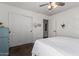 Bedroom with a ceiling fan, neutral paint, and sliding door closet at 33828 N Pate Pl, Cave Creek, AZ 85331