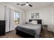 Bedroom with a neutral color scheme, ceiling fan, and view to the outside at 33828 N Pate Pl, Cave Creek, AZ 85331