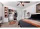 Bedroom with a closet, a dresser, and sports decor, creating a cozy space at 33828 N Pate Pl, Cave Creek, AZ 85331