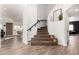 Stylish foyer with wood-look tile flooring, carpeted stairs, and a modern aesthetic at 33828 N Pate Pl, Cave Creek, AZ 85331