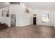 Spacious living room featuring vaulted ceilings, wood-look tile flooring, and a modern design at 33828 N Pate Pl, Cave Creek, AZ 85331