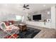 Stylish living room featuring a neutral palette, modern built-ins, and a comfortable sectional sofa at 33828 N Pate Pl, Cave Creek, AZ 85331