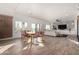 Spacious living area with tile flooring, an open floor plan, and a dining area view at 33828 N Pate Pl, Cave Creek, AZ 85331