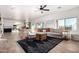 Open-concept living area with tile flooring, ample natural light, and stylish furnishings at 33828 N Pate Pl, Cave Creek, AZ 85331