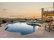 Inviting backyard pool with tanning ledge, lounge chairs, and a beautiful sunset view at 33828 N Pate Pl, Cave Creek, AZ 85331