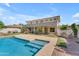 Beautiful home with a backyard pool, patio, outdoor kitchen and lush landscaping at 3806 E Taurus Pl, Chandler, AZ 85249