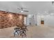 Expansive basement boasting brick wall, kitchenette, and staircase at 3806 E Taurus Pl, Chandler, AZ 85249