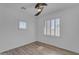 Bedroom features wood-look floors, ceiling fan and shuttered window at 3806 E Taurus Pl, Chandler, AZ 85249