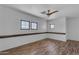 Bedroom featuring wood-look flooring, natural light, and a modern ceiling fan at 3806 E Taurus Pl, Chandler, AZ 85249
