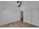 Bedroom with closet and fan featuring wood-look floors and white trim at 3806 E Taurus Pl, Chandler, AZ 85249
