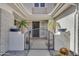 Inviting entrance with a secure gate and desert landscaping at 3806 E Taurus Pl, Chandler, AZ 85249