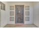 Stylish front door with a modern security screen and welcome mat at 3806 E Taurus Pl, Chandler, AZ 85249