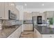 Stylish kitchen featuring a gas cooktop, sleek countertops, stainless steel appliances, and tile backsplash at 3806 E Taurus Pl, Chandler, AZ 85249