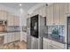 This open kitchen features custom cabinets, stainless appliances, and a geometric backsplash at 3806 E Taurus Pl, Chandler, AZ 85249
