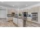 Well-equipped kitchen with stainless appliances, island with wine storage, and ample cabinet space at 3806 E Taurus Pl, Chandler, AZ 85249