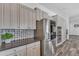 A modern kitchen with stainless steel appliances, custom cabinets, and a stylish backsplash at 3806 E Taurus Pl, Chandler, AZ 85249