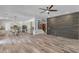 Open-concept living space connects kitchen, dining, and Gathering areas with wood-look tile floors at 3806 E Taurus Pl, Chandler, AZ 85249