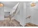 Bright foyer with a beautiful staircase and wood-look tile floors at 3806 E Taurus Pl, Chandler, AZ 85249