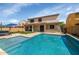 Backyard featuring a sparkling pool and covered patio, perfect for entertaining and relaxing outdoors at 3813 W Lapenna Dr, New River, AZ 85087