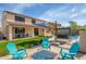 Backyard with a fire pit, outdoor seating, a manicured lawn, and a refreshing pool creating an inviting outdoor oasis at 3813 W Lapenna Dr, New River, AZ 85087