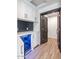 Bar area includes white cabinets, quartz countertops and beverage fridge at 3813 W Lapenna Dr, New River, AZ 85087
