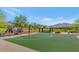 Outdoor basketball court with a covered picnic area and playground; perfect for Gathering fun at 3813 W Lapenna Dr, New River, AZ 85087