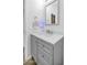 Bathroom features a white vanity, gray cabinets, and modern faucet at 3813 W Lapenna Dr, New River, AZ 85087