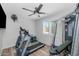 Home gym features wood-look floors, ample natural light, and exercise equipment at 3813 W Lapenna Dr, New River, AZ 85087