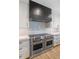Gourmet kitchen featuring stainless Wolf appliances, quartz counters, and custom cabinetry at 3813 W Lapenna Dr, New River, AZ 85087